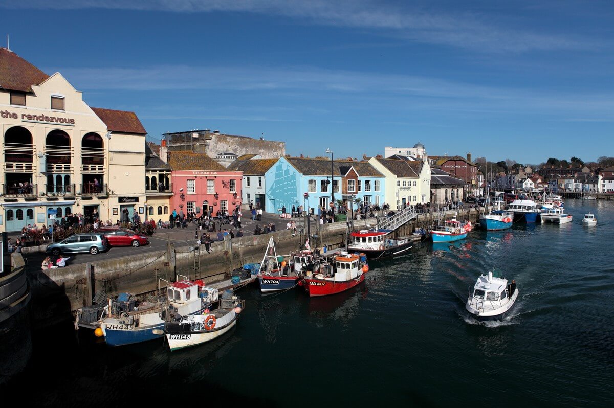 Boats and waterfront buildings at Weymouth harbour